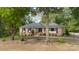 Ranch home with brick exterior and tree-lined street at 1935 Berkshire Dr, Gastonia, NC 28052