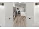 View through doorway of updated kitchen with white cabinets at 1935 Berkshire Dr, Gastonia, NC 28052