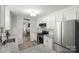 Bright kitchen boasting white cabinets, granite countertops, and stainless steel appliances at 1935 Berkshire Dr, Gastonia, NC 28052