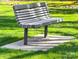 Wooden park bench on a concrete slab in a grassy area at 2037 Stephens Farm Dr # E, China Grove, NC 28023