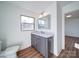 Bathroom features vanity with quartz countertop and window at 2705 Lowell Bethesda Rd, Gastonia, NC 28056
