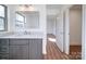 Bathroom features gray vanity, quartz countertop and view of another room at 2705 Lowell Bethesda Rd, Gastonia, NC 28056