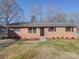 Brick ranch home with landscaped yard and carport at 2705 Lowell Bethesda Rd, Gastonia, NC 28056