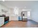 Modern kitchen with stainless steel appliances and white cabinets at 2705 Lowell Bethesda Rd, Gastonia, NC 28056