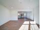 Open living room with kitchen view and hardwood floors at 2705 Lowell Bethesda Rd, Gastonia, NC 28056