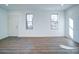 Living room with hardwood floors and large windows at 2705 Lowell Bethesda Rd, Gastonia, NC 28056