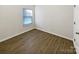 Bright bedroom with wood-look flooring and window blinds at 3744 Amber Meadows Dr, Charlotte, NC 28269