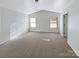Spacious bedroom with carpeted floors and large windows at 3744 Amber Meadows Dr, Charlotte, NC 28269
