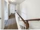 Upstairs hallway with carpet and access to bedrooms at 3744 Amber Meadows Dr, Charlotte, NC 28269