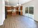 Open kitchen with island, stainless steel appliances, and access to patio at 3744 Amber Meadows Dr, Charlotte, NC 28269