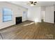 Spacious living room featuring a fireplace and hardwood floors at 3744 Amber Meadows Dr, Charlotte, NC 28269