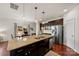 Island kitchen with granite countertops and stainless steel appliances at 5932 Gilchrist Cir, Belmont, NC 28012