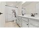 Bathroom boasts double vanity and a fun dinosaur shower curtain at 6270 Durango Way, Denver, NC 28037