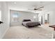 Spacious bedroom with plush carpeting and ceiling fan at 6270 Durango Way, Denver, NC 28037