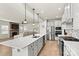 Modern kitchen with white cabinets, stainless steel appliances and an island at 6270 Durango Way, Denver, NC 28037