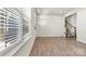 Living room with hardwood floors and large window with blinds at 6270 Durango Way, Denver, NC 28037