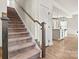Elegant staircase with carpeted steps and wooden railing at 6270 Durango Way, Denver, NC 28037