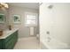 Bathroom with white subway tile shower and hexagon floor tile at 6800 Newhall Rd, Charlotte, NC 28270