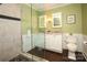 Updated bathroom with double vanity, glass shower, and granite countertop at 6800 Newhall Rd, Charlotte, NC 28270