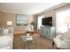 Light-filled living room with hardwood floors and comfy seating at 6800 Newhall Rd, Charlotte, NC 28270