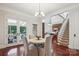 Cozy dining area with a view of the screened porch and backyard at 7007 Dowington Dr, Charlotte, NC 28277