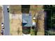 An aerial view of a home with a hot tub, fenced-in backyard, and well-maintained landscaping at 712 Georgie St, Troutman, NC 28166