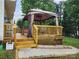 Backyard deck with stairs leading to a gazebo-covered dining area and a hot tub at 712 Georgie St, Troutman, NC 28166
