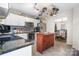 Fully equipped kitchen with white cabinets, stainless steel appliances, granite countertops, and center island at 712 Georgie St, Troutman, NC 28166