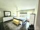 Spacious main bedroom with a ceiling fan, bright windows, and neutral decor at 712 Georgie St, Troutman, NC 28166