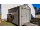 Exterior shot of the shed with a brown color scheme, located in the backyard at 712 Georgie St, Troutman, NC 28166
