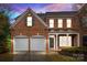 Brick townhouse exterior at night at 7905 Oratorio Pl, Charlotte, NC 28270