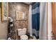 Simple bathroom with shower, vanity, and decorative accents at 8064 Reeps Grove Church Rd, Vale, NC 28168