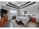 Large main bedroom with wood furniture and ceiling fan at 8247 Lambert Ct, Denver, NC 28037