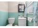 Bathroom featuring a clean white vanity and a vintage tile wall, offering a functional space at 906 16Th Nw St, Conover, NC 28613