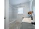 Updated bathroom with subway tile, modern vanity, and bathtub at 913 S Franklin St, China Grove, NC 28023