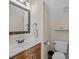 Cozy powder room with vanity sink and toilet at 10015 Lattice Ct, Charlotte, NC 28269