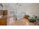 Well-lit bedroom with hardwood floors and a view to the outside at 10015 Lattice Ct, Charlotte, NC 28269