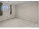 Neutral bedroom with ample light from the window, and plush carpeting at 10015 Lattice Ct, Charlotte, NC 28269