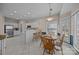 Bright breakfast nook with a round table and white tiled bar area next to the kitchen at 10015 Lattice Ct, Charlotte, NC 28269