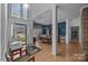 Light-filled dining room featuring hardwood floors, wainscoting, and elegant chandelier at 10015 Lattice Ct, Charlotte, NC 28269