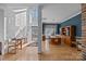 Bright and airy foyer featuring towering windows, hardwood floors, and dining area at 10015 Lattice Ct, Charlotte, NC 28269