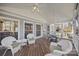 Inviting screened porch with ample seating and a ceiling fan for relaxing outdoors at 10015 Lattice Ct, Charlotte, NC 28269