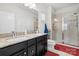 Bathroom with granite countertops and walk-in shower at 10356 Black Locust Ln, Harrisburg, NC 28215