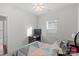 Bedroom with ceiling fan and window coverings at 10356 Black Locust Ln, Harrisburg, NC 28215