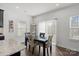 Bright dining area with table and chairs, near sliding glass doors at 10356 Black Locust Ln, Harrisburg, NC 28215