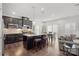 Modern kitchen with dark cabinetry and granite countertops at 10356 Black Locust Ln, Harrisburg, NC 28215