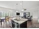 Modern kitchen with granite countertops and a large island at 10356 Black Locust Ln, Harrisburg, NC 28215