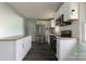 Modern kitchen featuring stainless steel appliances, granite countertops, and white cabinets at 1221 S Myrtle School Rd, Gastonia, NC 28052