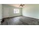 Spacious living room with new floors, neutral paint, and a large window for natural light at 1221 S Myrtle School Rd, Gastonia, NC 28052