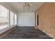 Bright sunroom with multiple windows, brick accents, and wood-look floors at 1221 S Myrtle School Rd, Gastonia, NC 28052